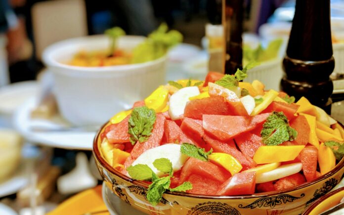 Photo by Kawshar Ahmed sliced fruits in brown ceramic bowl